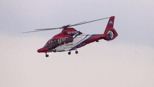 Red white helicopter flying sky free wallpaper for desktop - medium preview image