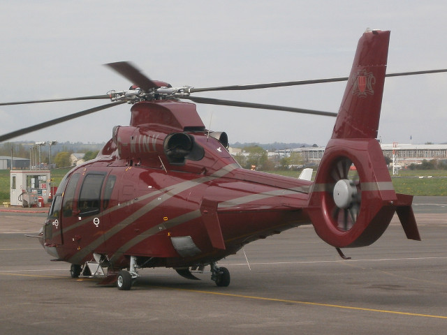 Red helicopter airport tarmac sky free wallpaper for desktop - medium preview image