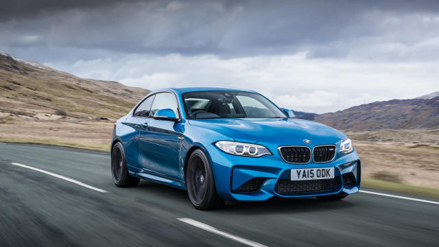 Blue bmw car driving mountains free wallpaper for desktop - medium preview image