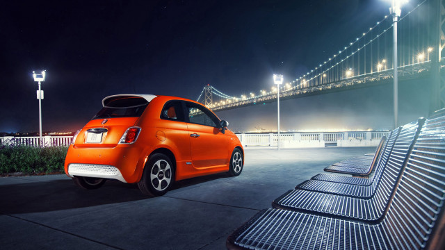 Orange car parked bridge night free wallpaper for desktop - medium preview image