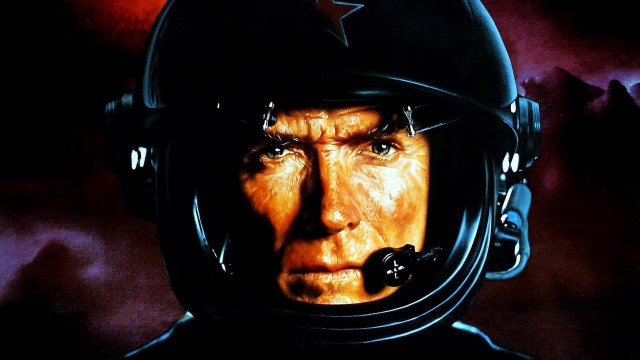 Man helmet mustache staring camera free wallpaper for desktop - medium preview image