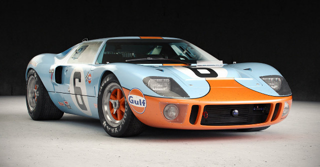 Blue orange race car garage free wallpaper for desktop - medium preview image