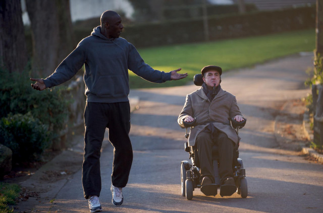 Man pushing wheelchair hat jacket free wallpaper for desktop - medium preview image