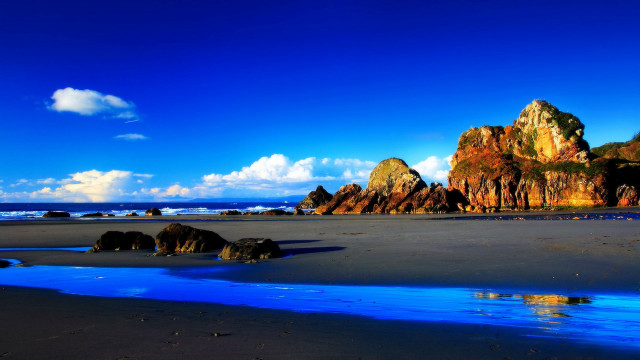 Beach blue water rocks blue free wallpaper for desktop - medium preview image
