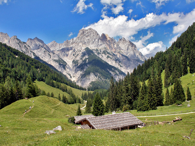 Small cabin grassy field mountains free wallpaper for desktop - medium preview image