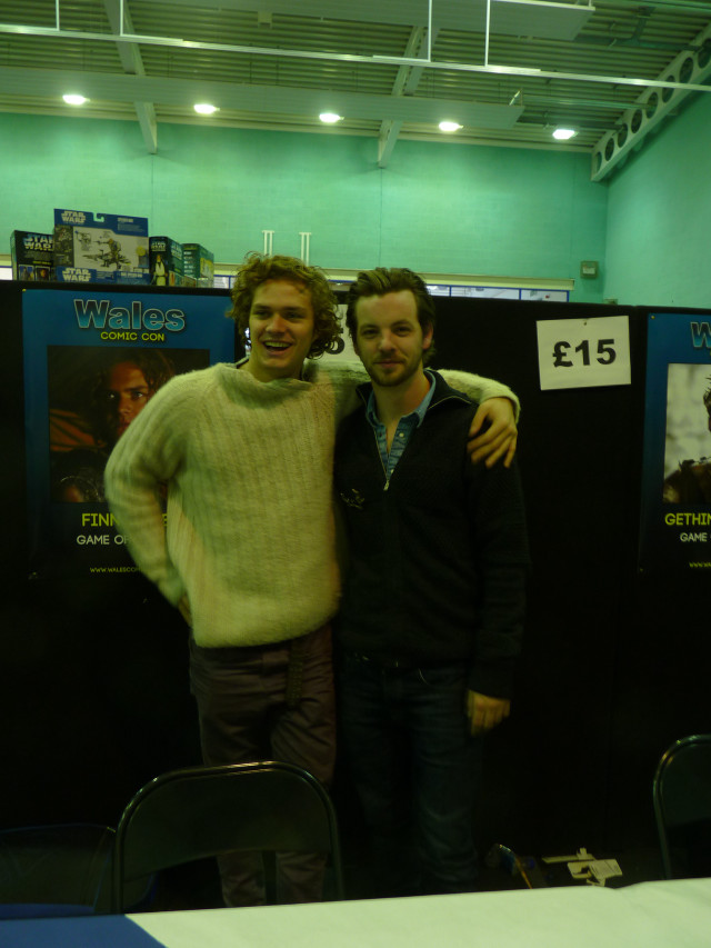 Two men poster wall table free wallpaper for mobile - medium preview image