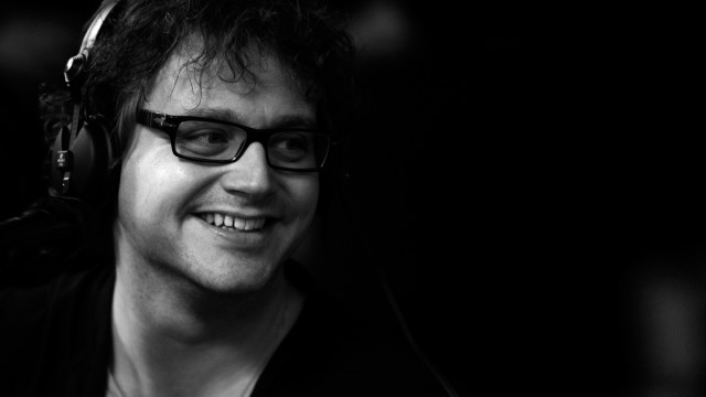 Man smiling headphones black white free wallpaper for desktop - medium preview image