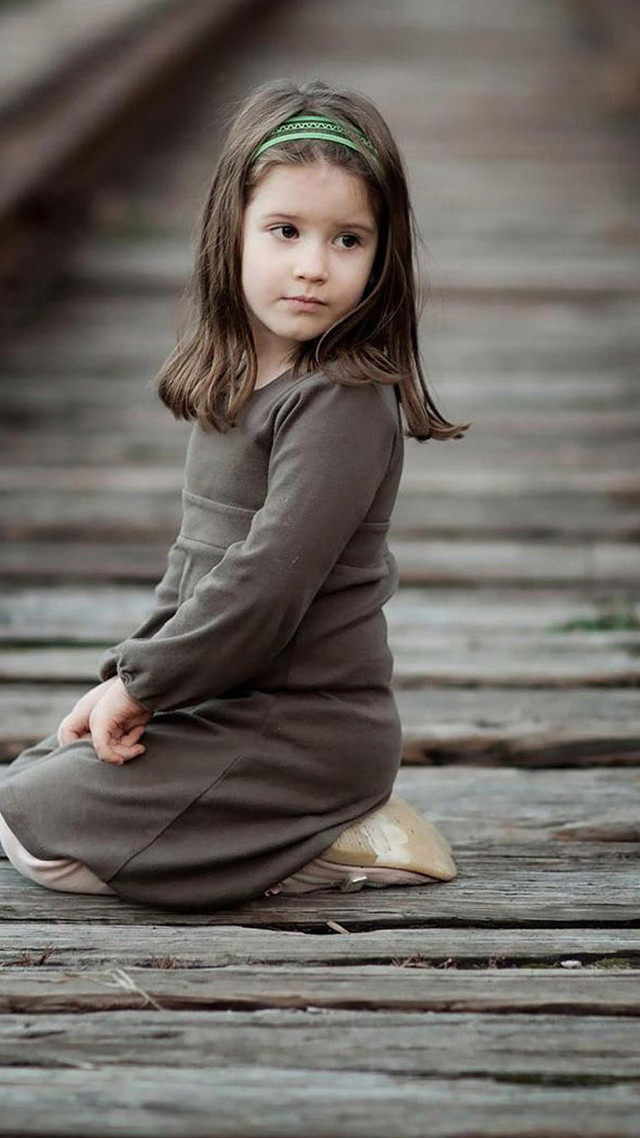 Little girl portrait wooden floor free wallpaper for mobile - medium preview image