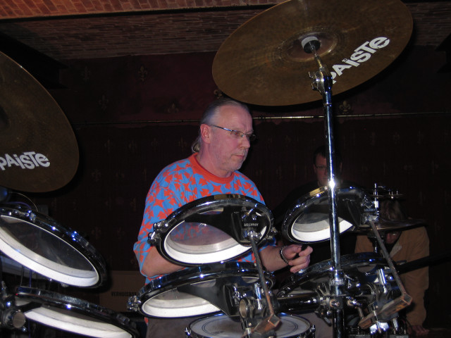 Man playing drums brick wall free wallpaper for desktop - medium preview image