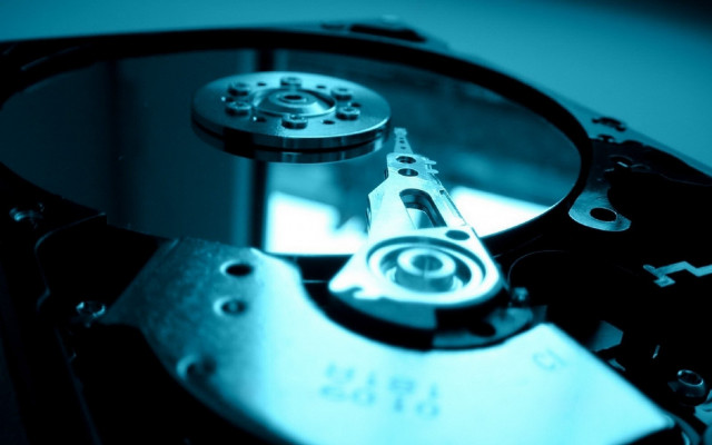 Hard drive closeup blue background free wallpaper for desktop - medium preview image