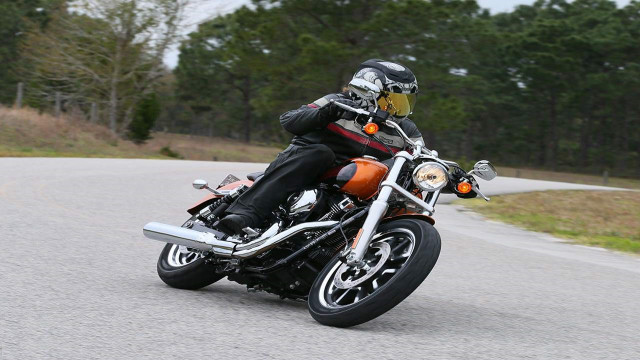 Man motorcycle curvy road forest free wallpaper for desktop - medium preview image