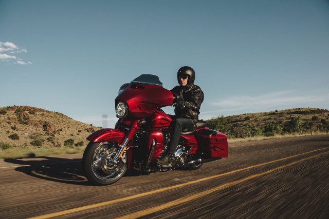 Man riding red motorcycle green free wallpaper for desktop - medium preview image