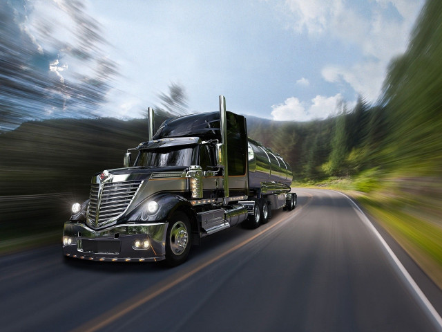 Semi truck driving road trees free wallpaper for desktop - medium preview image