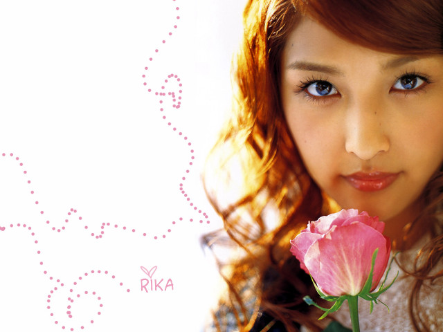 Woman holding pink rose smiling free wallpaper for desktop - medium preview image