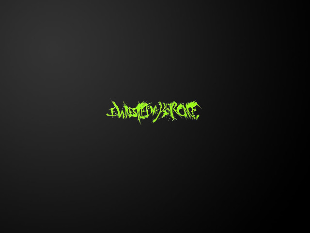 Black background green lettering says free wallpaper for desktop - medium preview image