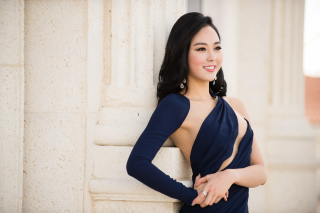 Woman blue dress leaning wall #6 free wallpaper for desktop - medium preview image