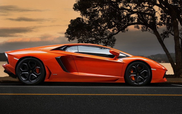 Orange sports car water sunset free wallpaper for desktop - medium preview image