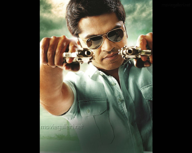 Man holding two guns wearing free wallpaper for desktop - medium preview image