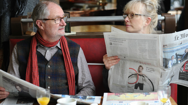 Man woman table newspapers orange free wallpaper for desktop - medium preview image