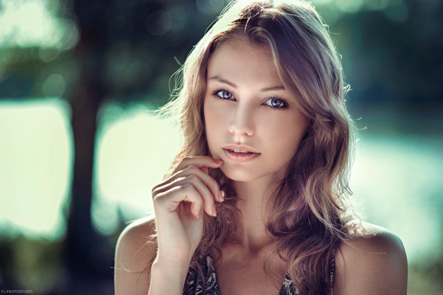 Woman blue eyes posing hand free wallpaper for desktop - medium preview image