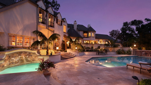 Large house pool patio nighttime free wallpaper for desktop - medium preview image