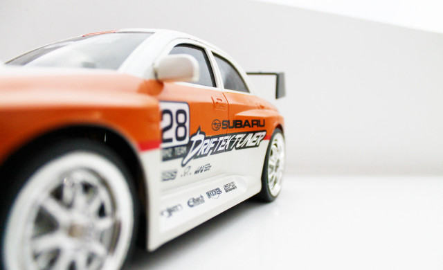 Toy car white surface background free wallpaper for desktop - medium preview image