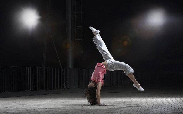 Woman handstand brick floor dark free wallpaper for desktop - medium preview image