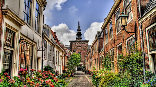 Narrow street clock tower flowers #2 free wallpaper for desktop - medium preview image