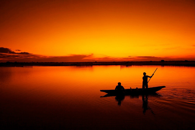 Two people boat lake sunset free wallpaper for desktop - medium preview image
