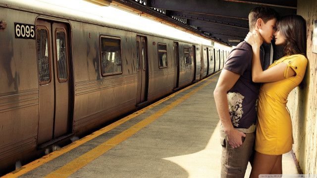 Man woman kissing train station #3 free wallpaper for desktop - medium preview image