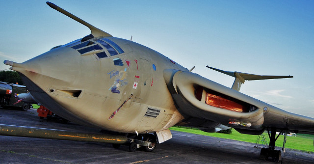 Airplane tarmac grass trees sky free wallpaper for desktop - medium preview image