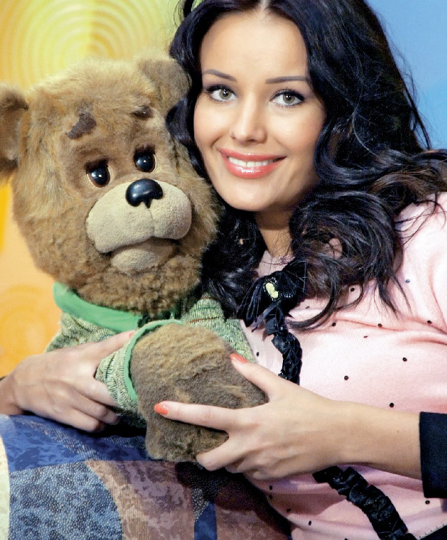 Woman holding teddy bear smiling free wallpaper for mobile - medium preview image