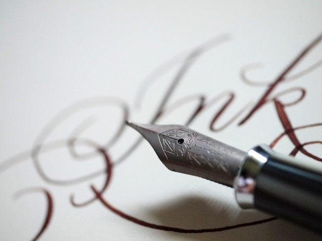 Fountain pen red ink writing free wallpaper for desktop - medium preview image