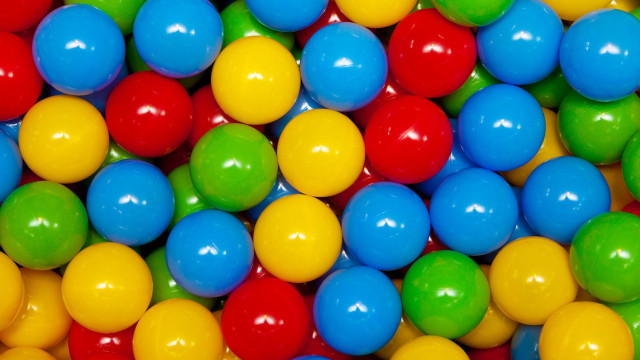 Colorful balls pile white background free wallpaper for desktop - medium preview image