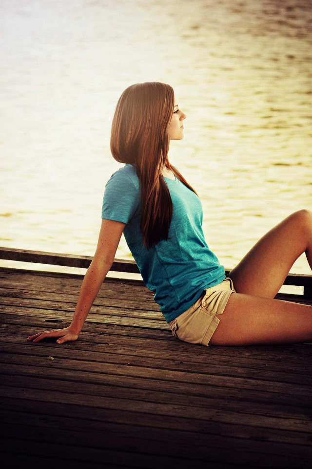 Woman sitting dock water boat free wallpaper for mobile - medium preview image