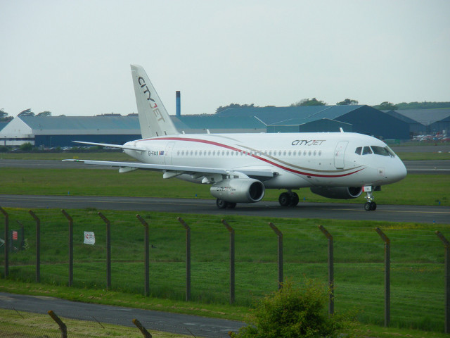 Large white airplane runway fence free wallpaper for desktop - medium preview image
