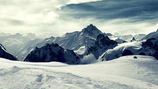 Person on skis snowy mountain #2 free wallpaper for desktop - medium preview image
