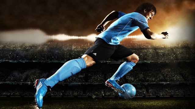 Soccer player kicking ball stadium #5 free wallpaper for desktop - medium preview image