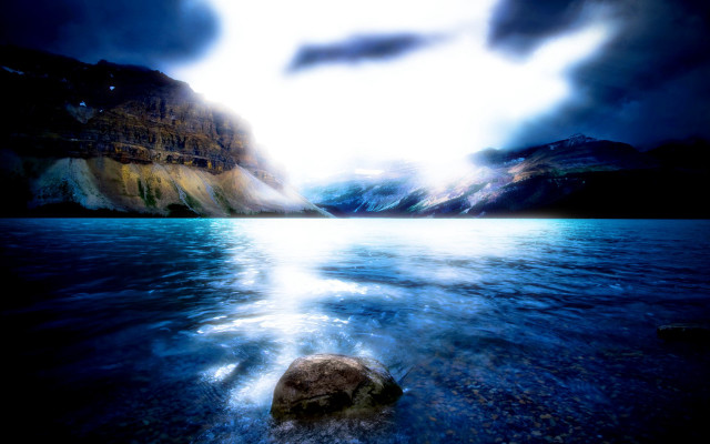 Rock lake mountains cloudy sky free wallpaper for desktop - medium preview image