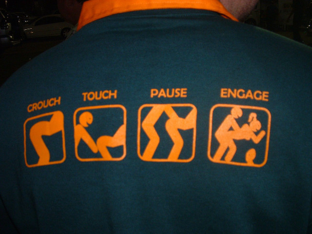 Man green shirt orange lettering free wallpaper for desktop - medium preview image