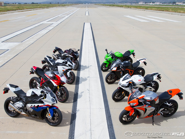 Motorcycles parked runway sky background free wallpaper for desktop - medium preview image