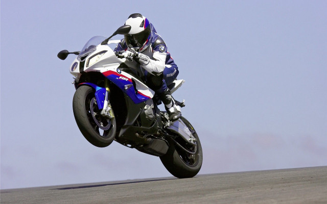 Motorcycle trick air hillside sky free wallpaper for desktop - medium preview image