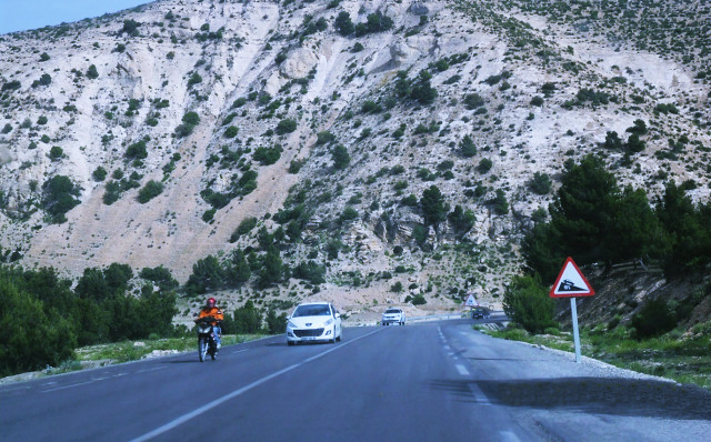 Man bike mountain road car free wallpaper for desktop - medium preview image