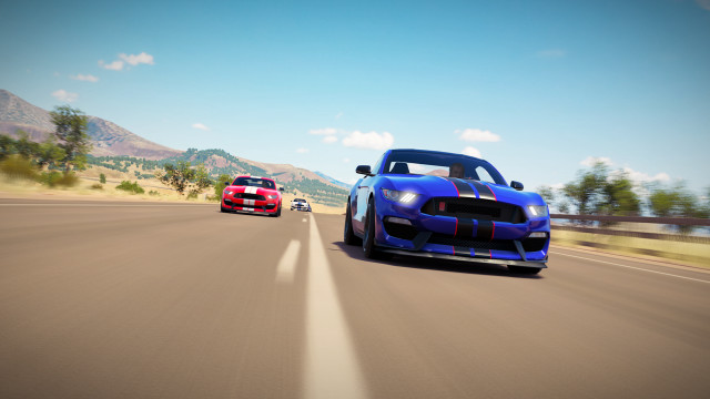 Cars driving road mountains blue free wallpaper for desktop - medium preview image