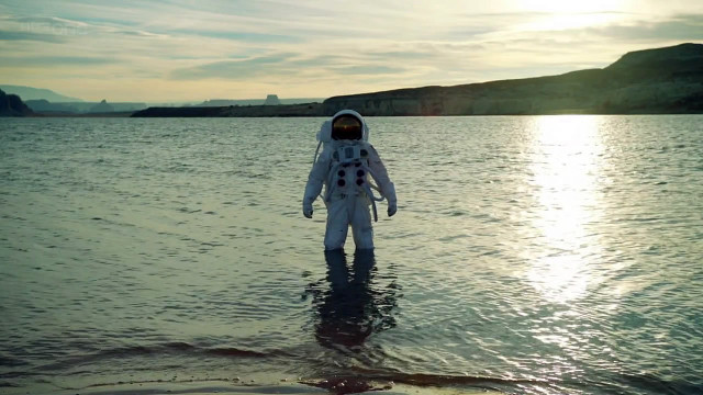 Man space suit water mountain free wallpaper for desktop - medium preview image