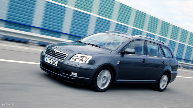 Blue car driving street building free wallpaper for desktop - medium preview image