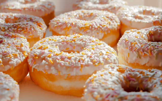 Glazed donuts sprinkles bite taken free wallpaper for desktop - medium preview image