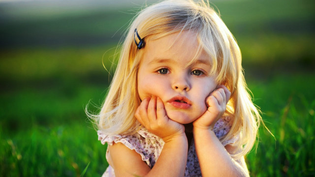 Little girl grass hands face #5 free wallpaper for desktop - medium preview image