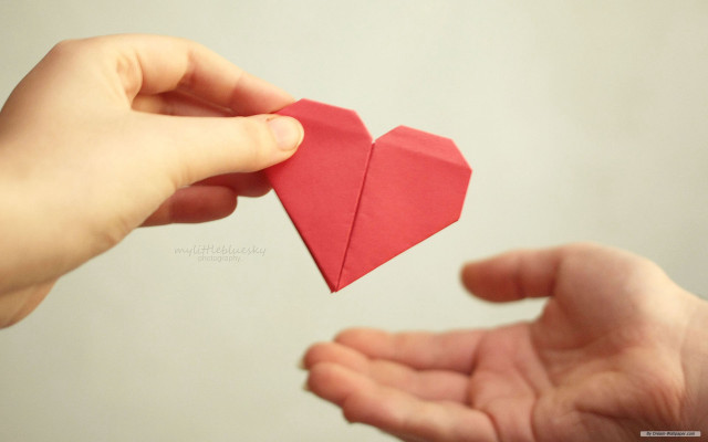 Person holding red origami heart free wallpaper for desktop - medium preview image
