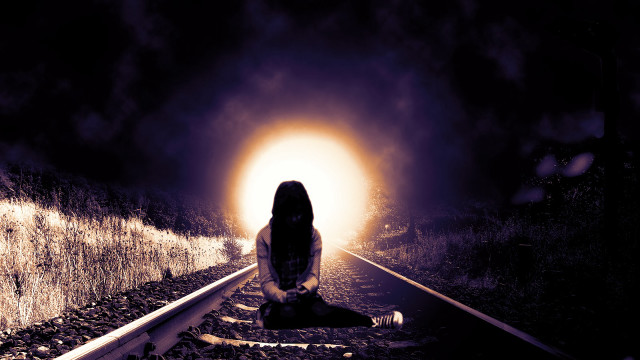 Person sitting train track dark free wallpaper for desktop - medium preview image